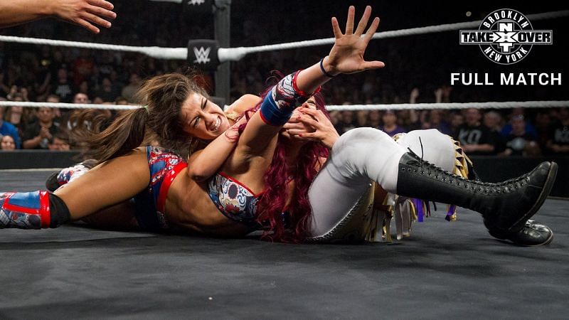 Sasha Banks struggles to escape from Bayley's submission attempt at NXT Takeover Brooklyn.